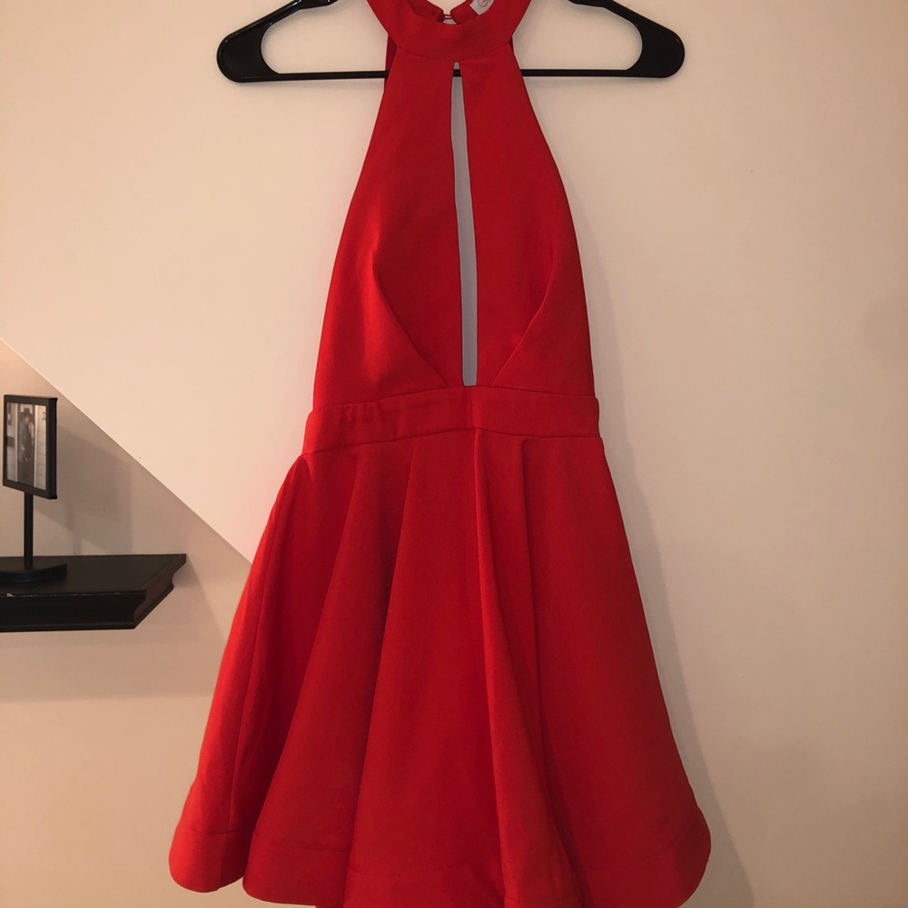 Red unworn dress. Halter at the top